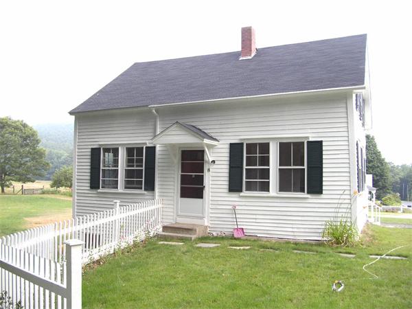 8 Winchester Road Warwick, MA 01378 - Photo 1 of 1 a front view of a house with a yard