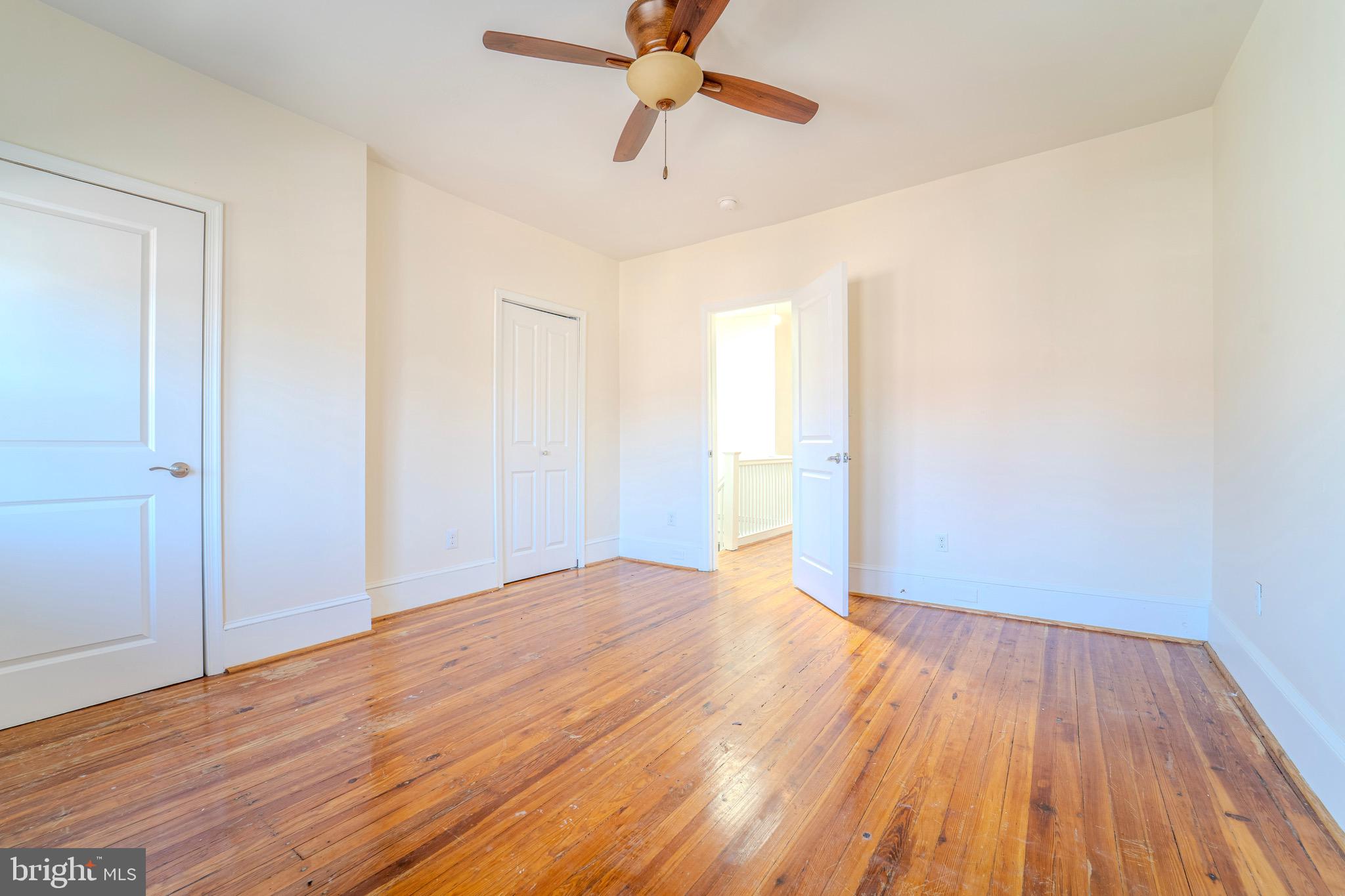 225 South 49th Street, Unit 2 Philadelphia, PA 19139 - Photo 22 of 26 a view of an empty room with wooden floor