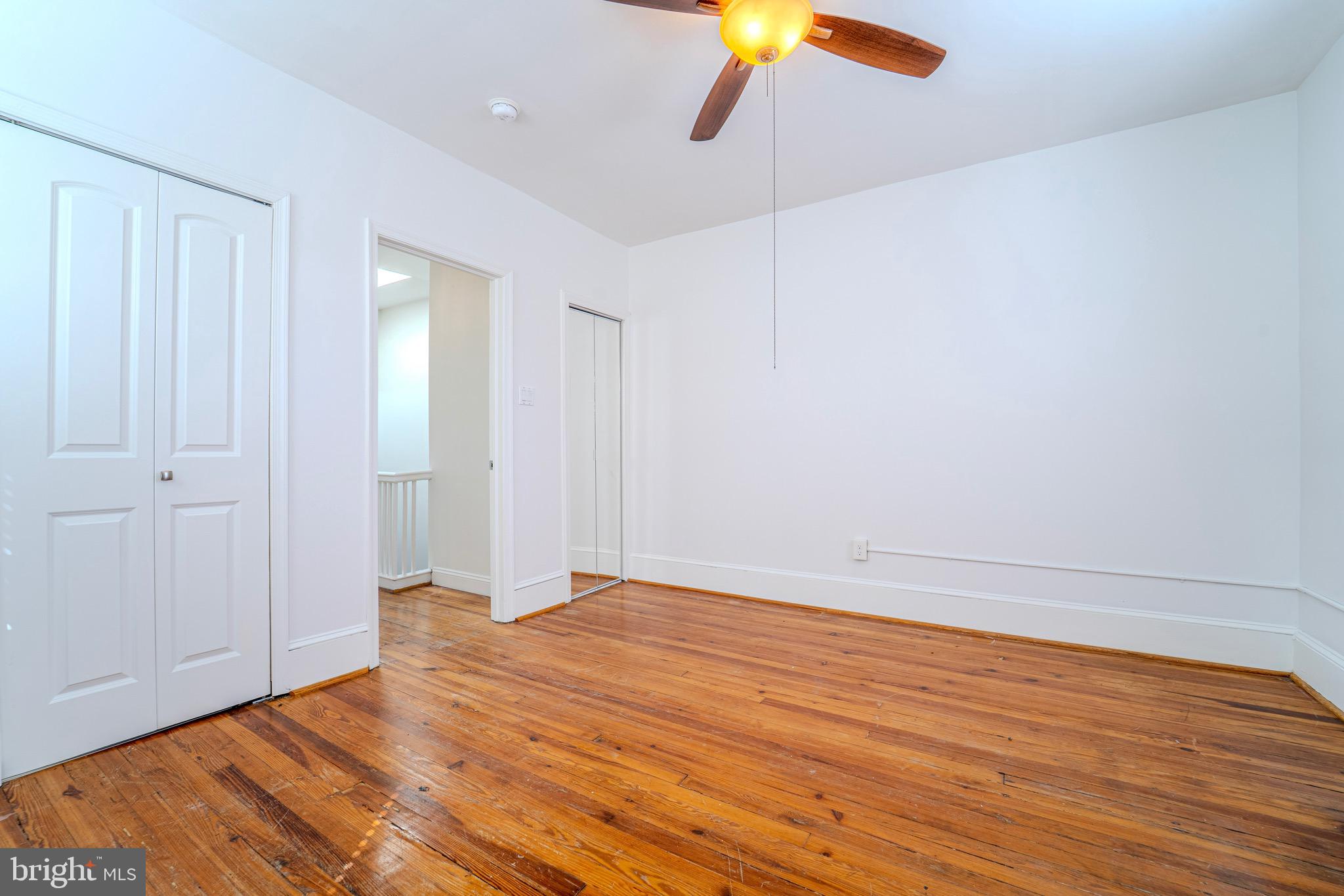 225 South 49th Street, Unit 2 Philadelphia, PA 19139 - Photo 24 of 26 a view of an empty room with wooden floor