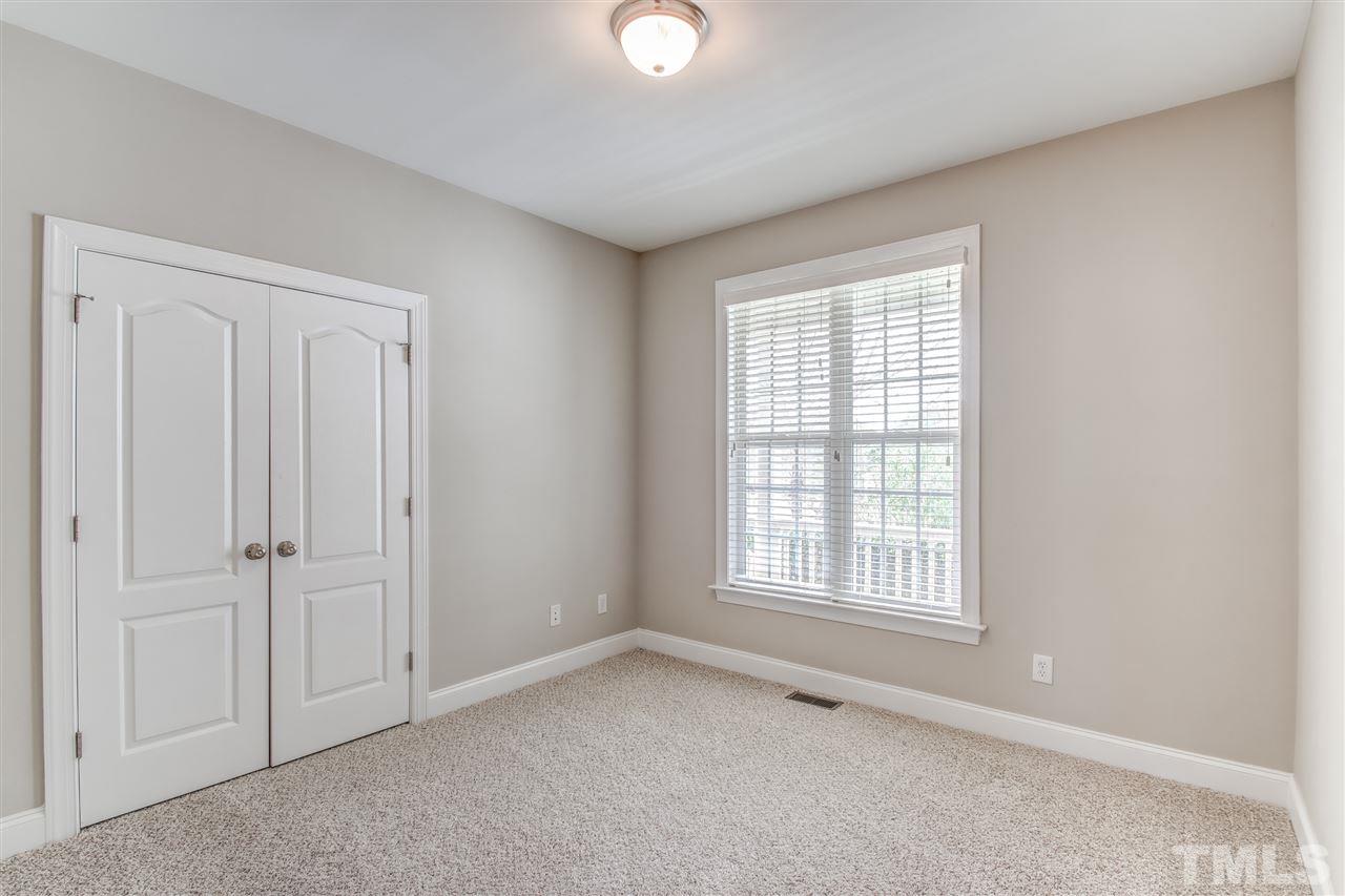 8905 Oregon Inlet Court Raleigh, NC 27603 - Photo 15 of 30 an empty room with windows and closet