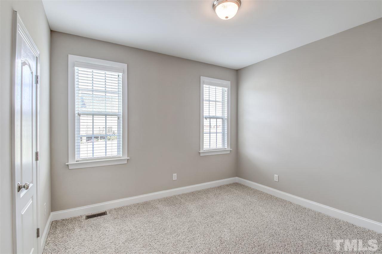 8905 Oregon Inlet Court Raleigh, NC 27603 - Photo 16 of 30 an empty room with windows