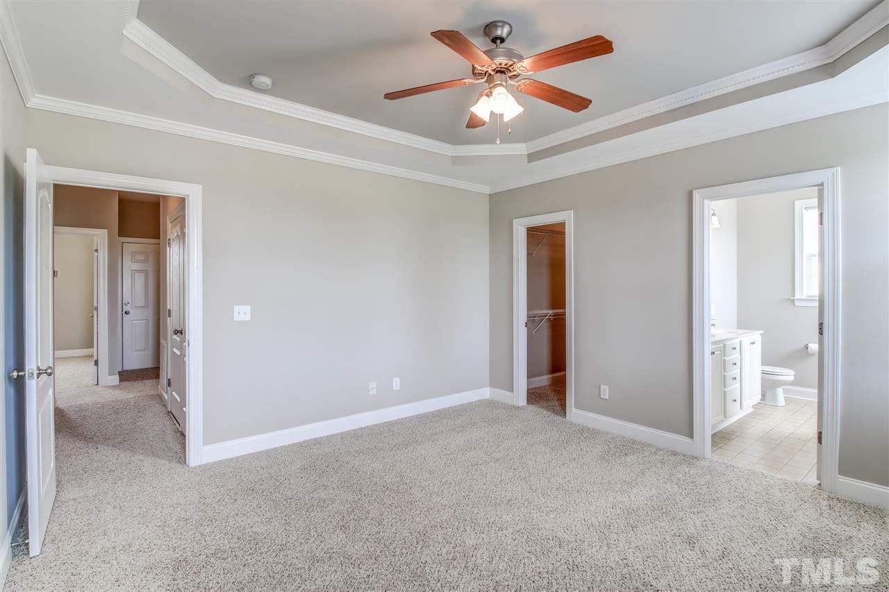 8905 Oregon Inlet Court Raleigh, NC 27603 - Photo 20 of 30 an empty room and chandelier fan