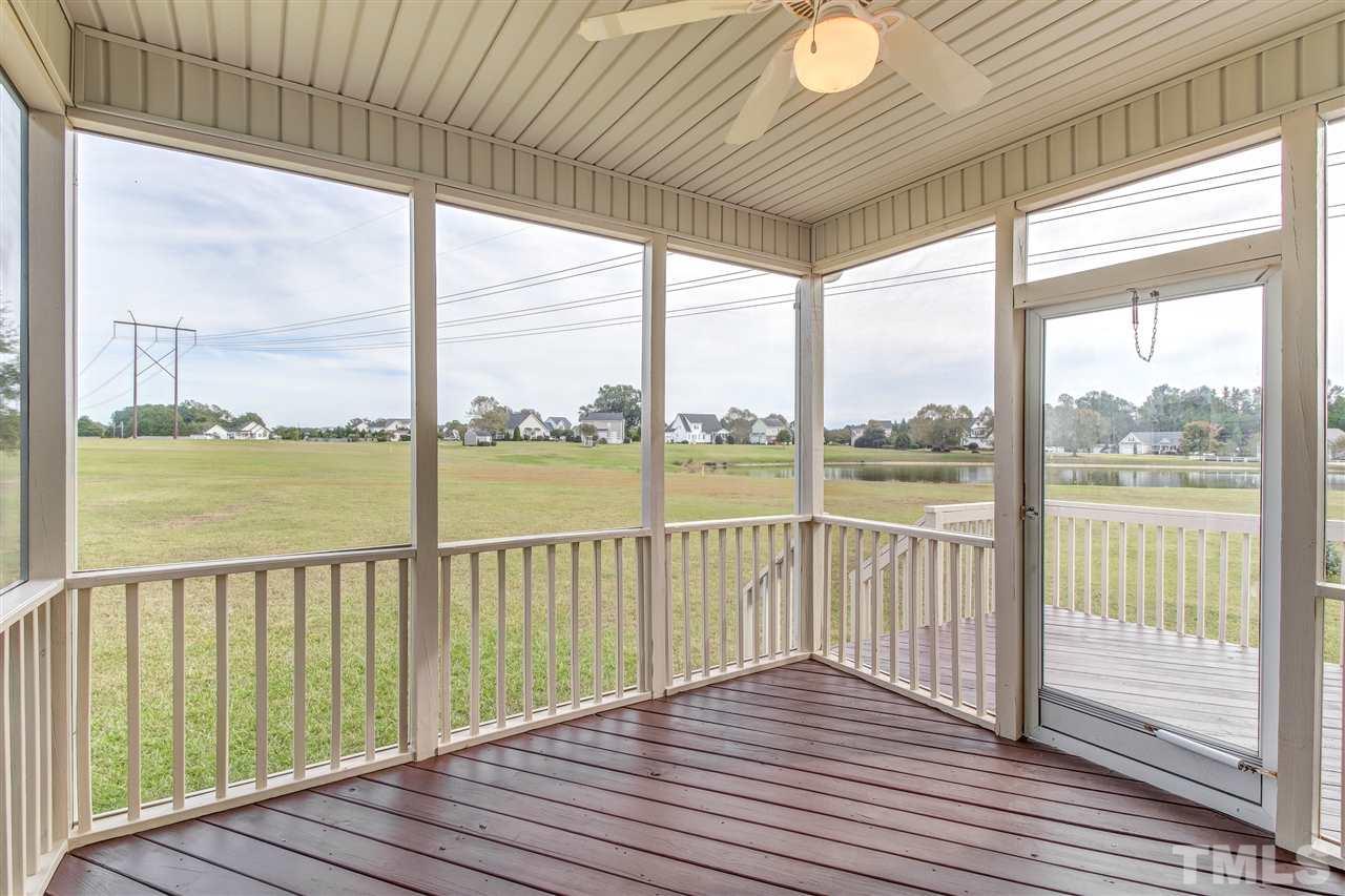 8905 Oregon Inlet Court Raleigh, NC 27603 - Photo 25 of 30 a view of a balcony with wooden floor
