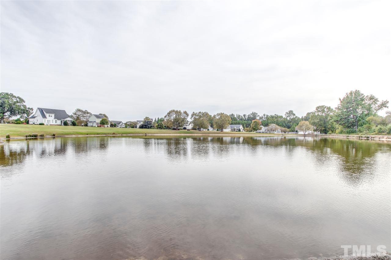 8905 Oregon Inlet Court Raleigh, NC 27603 - Photo 30 of 30 a view of a lake with houses