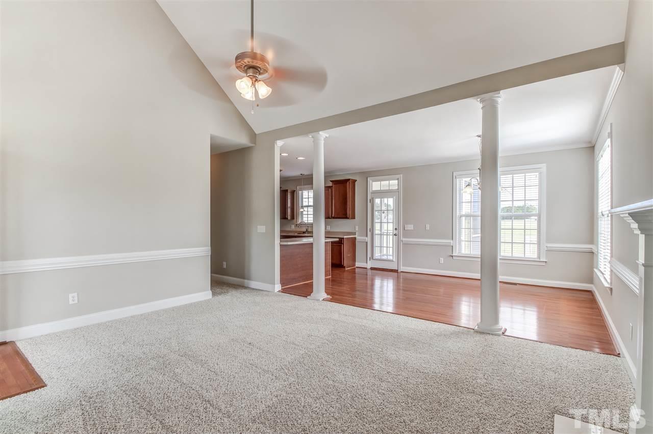 8905 Oregon Inlet Court Raleigh, NC 27603 - Photo 6 of 30 a view of a big room with windows and chandelier