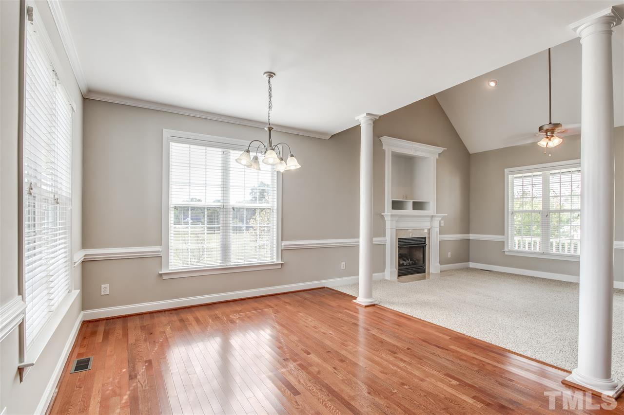 8905 Oregon Inlet Court Raleigh, NC 27603 - Photo 9 of 30 a view of empty room with wooden floor and fan