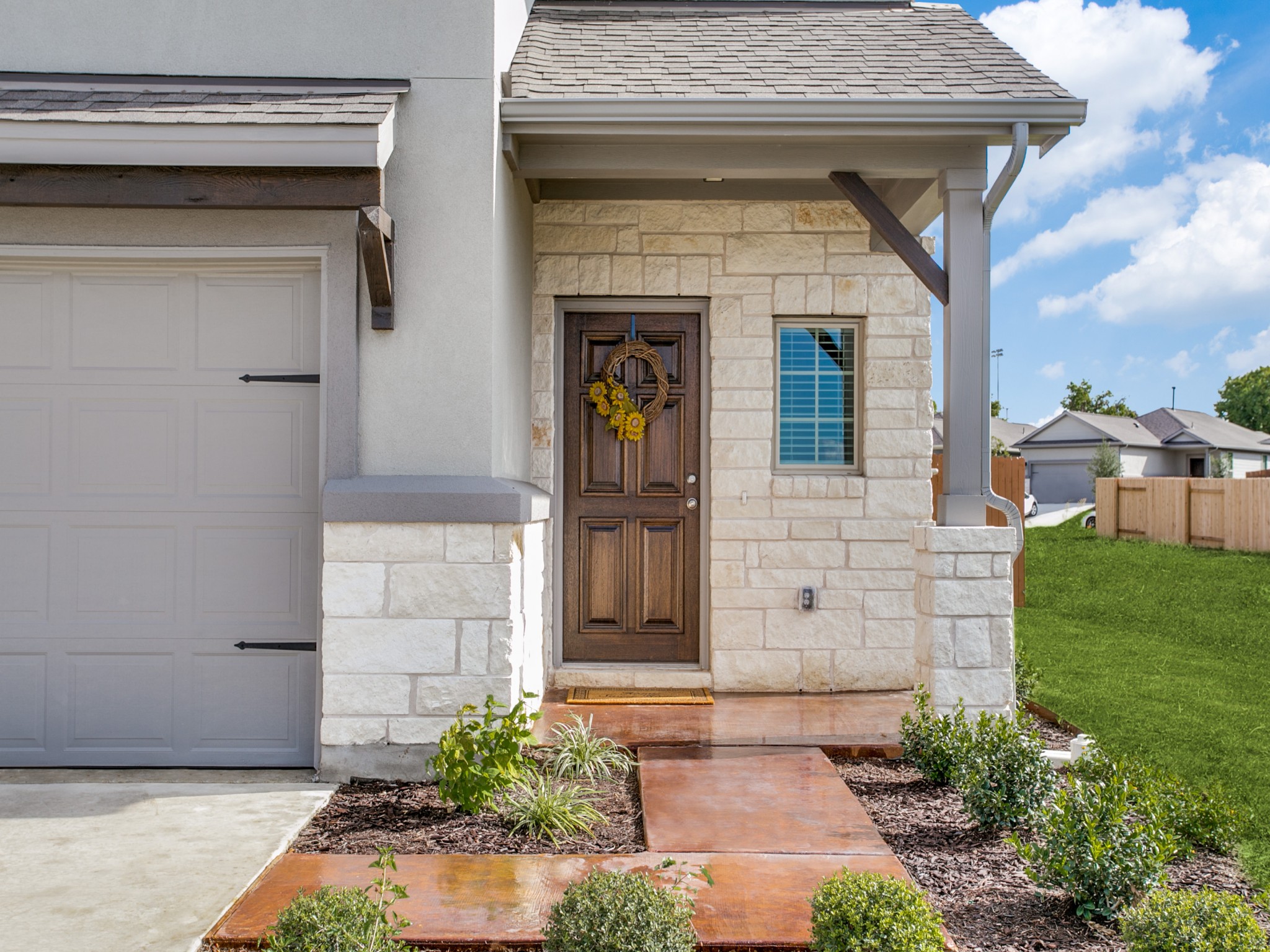 508 Rearing Mare Pass Georgetown, TX 78626 - Photo 2 of 26 Home entrance with stone siding and an attached garage