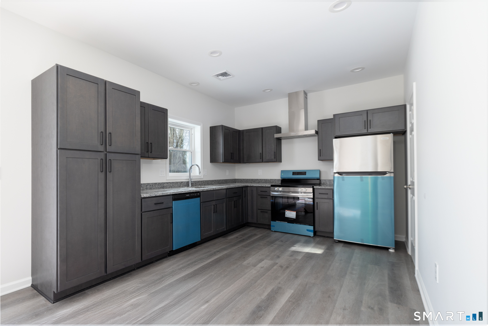 75 High Street Plymouth, CT 06786 - Photo 2 of 17 a kitchen with stainless steel appliances granite countertop a refrigerator stove and a sink
