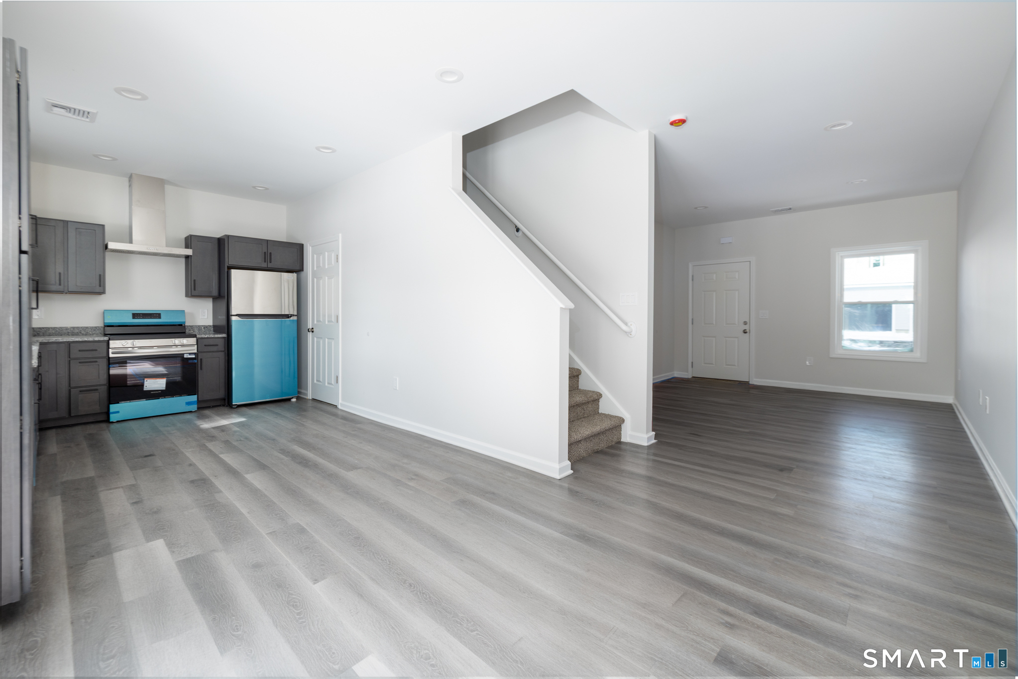 75 High Street Plymouth, CT 06786 - Photo 3 of 17 a view of a livingroom with furniture and wooden floor