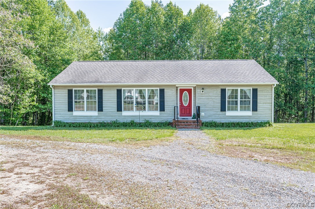 4640 Three Chopt Road Gum Spring, VA 23065 - Photo 1 of 27 a front view of a house with a yard and porch