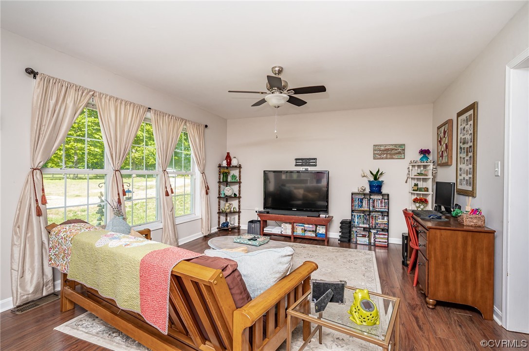 4640 Three Chopt Road Gum Spring, VA 23065 - Photo 6 of 27 a living room with furniture a flat screen tv and a large window