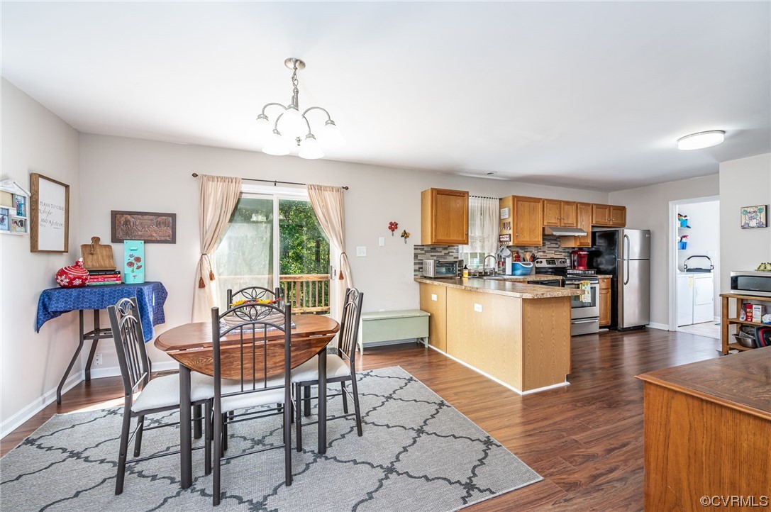 4640 Three Chopt Road Gum Spring, VA 23065 - Photo 9 of 27 a dining room filled counter top space and a dining table with kitchen view
