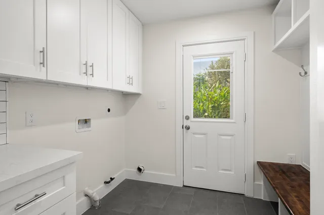 a view of cabinets and utility room