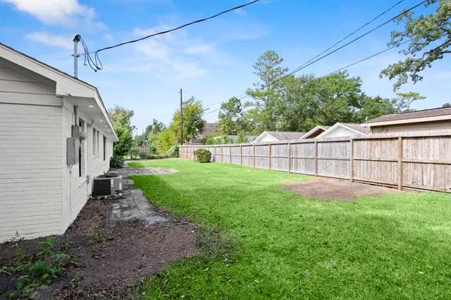 a view of a back yard of the house