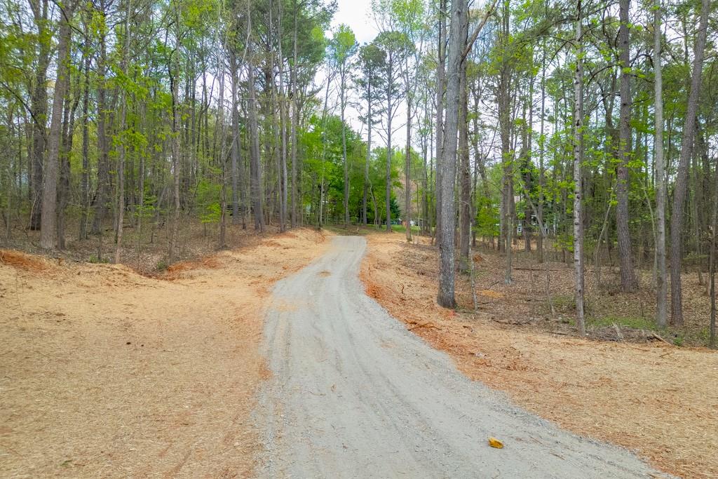 7925 Lotus Walk Road Cumming, GA 30041 - Photo 9 of 11 a backyard of a house with lots of green space