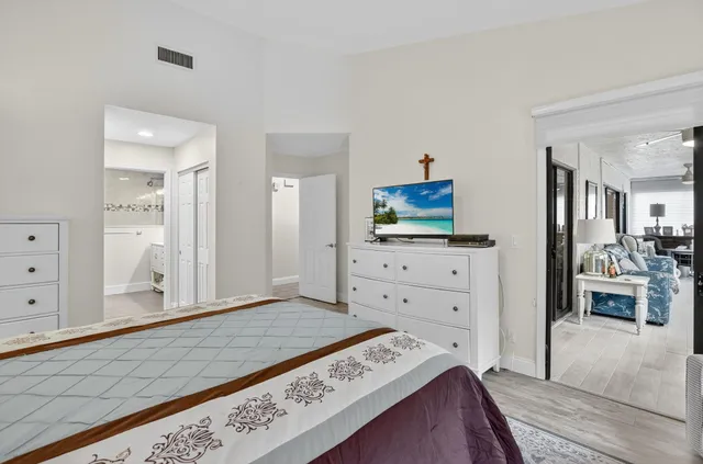 a view of a livingroom with furniture and floor to ceiling window