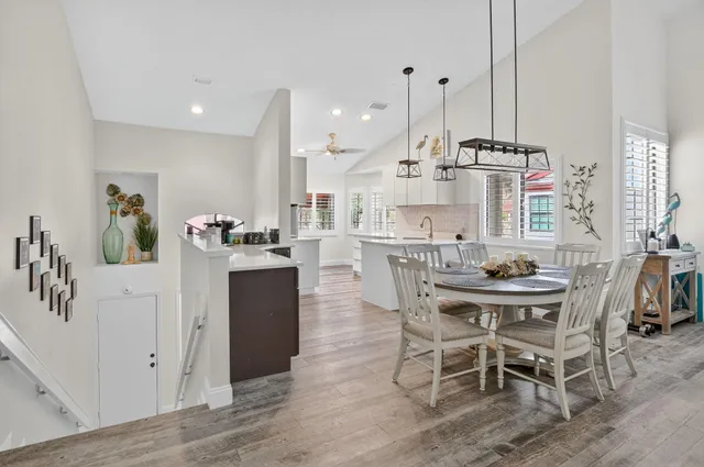 a dining table chairs and a kitchen view