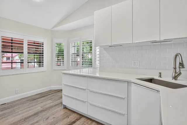 a kitchen with appliances cabinets and a sink
