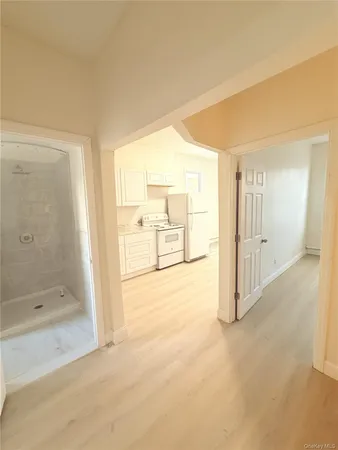 a view of a bathroom with tub and shower