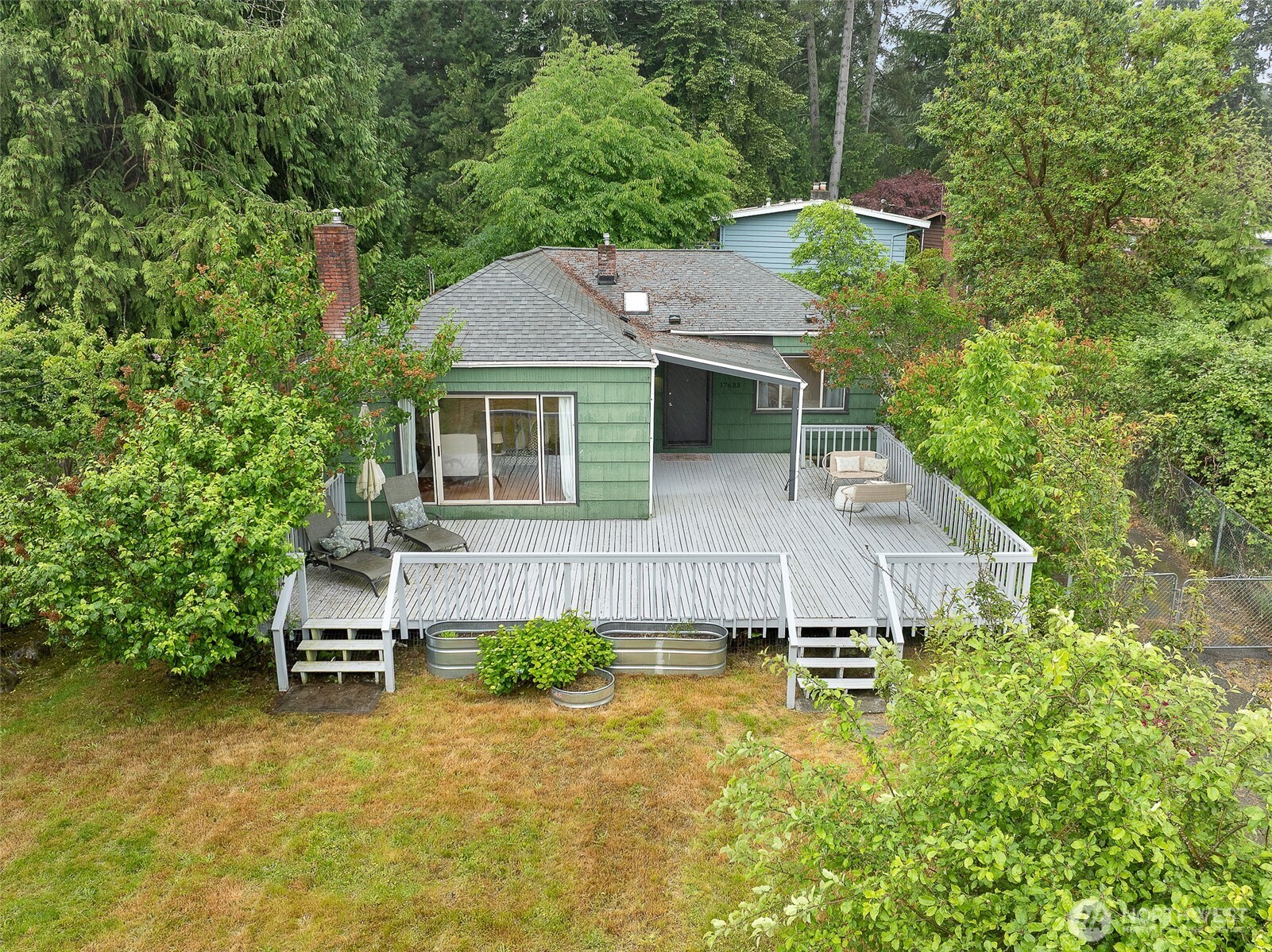 17633 10th Avenue Northeast Shoreline, WA 98155 - Photo 28 of 33 aerial view of a house with a yard balcony and furniture