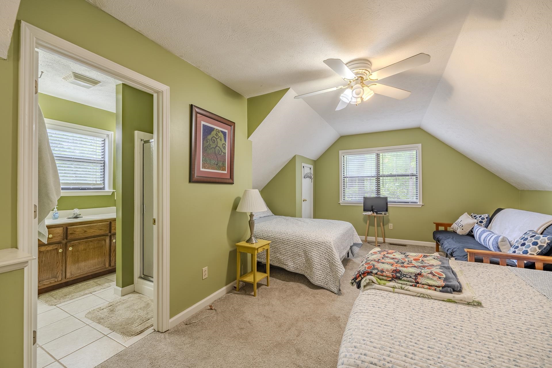 405 Murray Lane Counce, TN 38326 - Photo 27 of 36 a bedroom with a bed and a chandelier