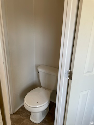 1265 North Corbonville Road, Unit 100 Price, UT 84501 - Photo 6 of 10 Bathroom with toilet and dark tile patterned floors