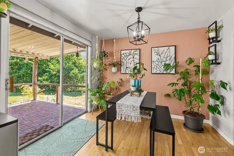 a view of a dining room with furniture window and outside view