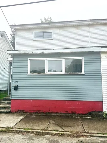 a view of a red and white house