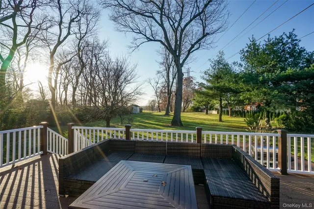 a view of a wooden deck with a bench