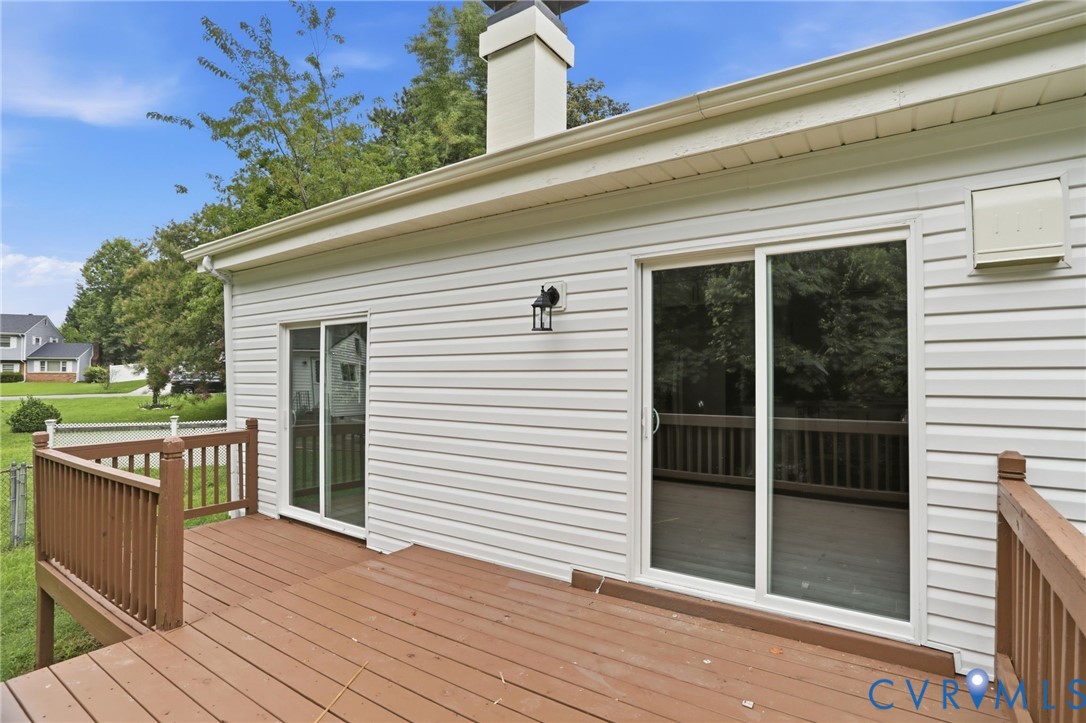 5301 Dalglish Road Richmond, VA 23223 - Photo 35 of 42 Expansive wood-finish deck with brown railing, fea
