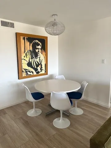 a kitchen with sink a microwave and refrigerator