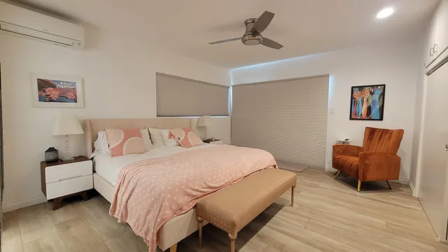 a room with window and bed