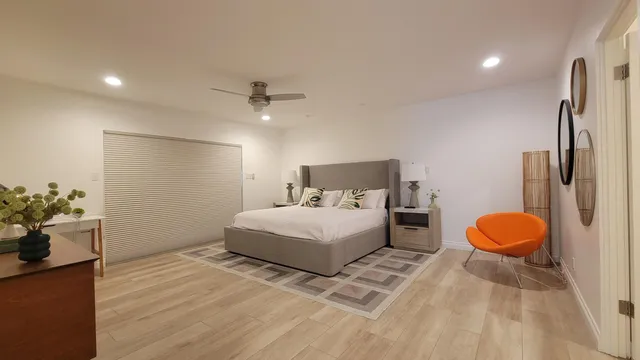 a view of a kitchen with center island and wooden floor