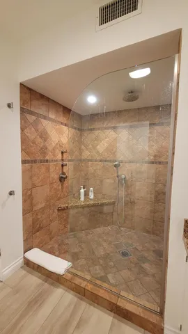 a view of swimming pool from a balcony