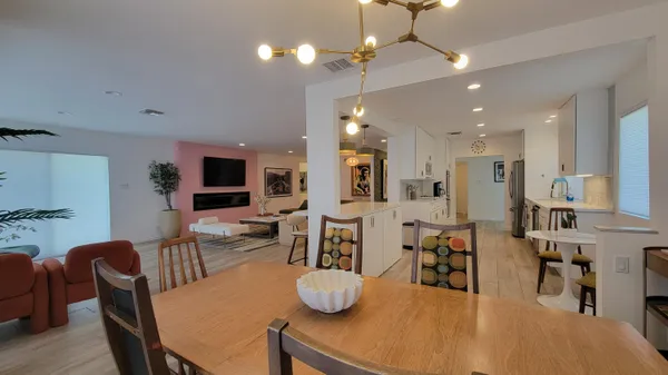 a living room with furniture and a table