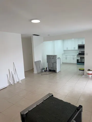 a kitchen with furniture and window
