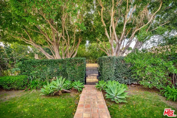 a view of a pathway both side of yard