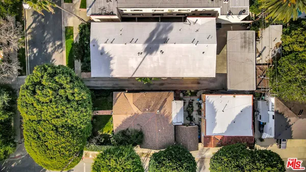 an aerial view of residential houses with outdoor space