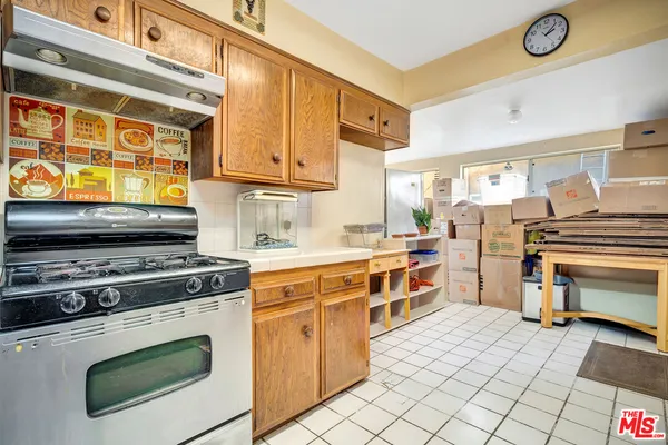 a kitchen with stainless steel appliances granite countertop a stove and a sink