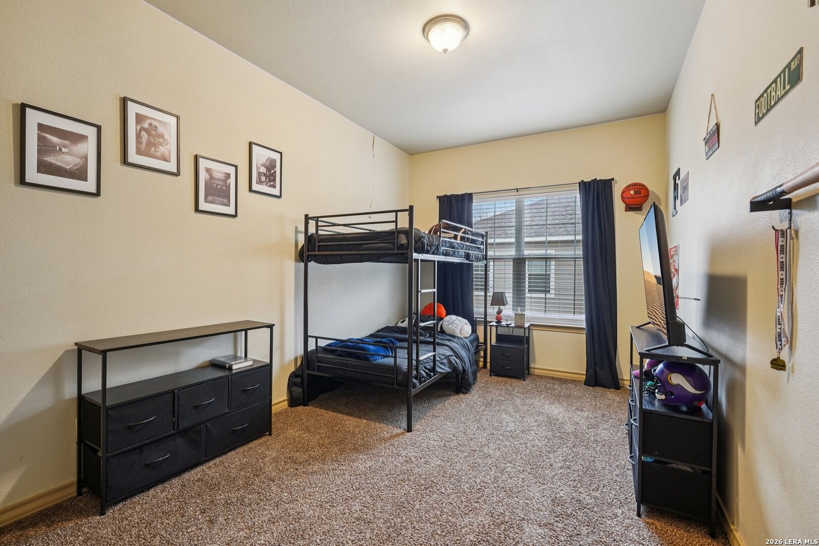 2312 Sailing Way, Unit D Kerrville, TX 78028 - Photo 18 of 25 a bedroom with furniture and a bed