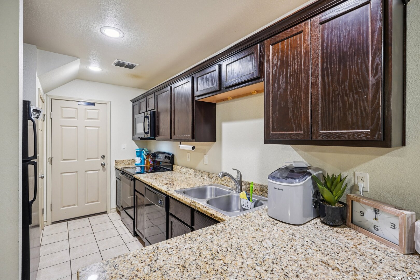 2312 Sailing Way, Unit D Kerrville, TX 78028 - Photo 9 of 25 a kitchen with a sink cabinets and window