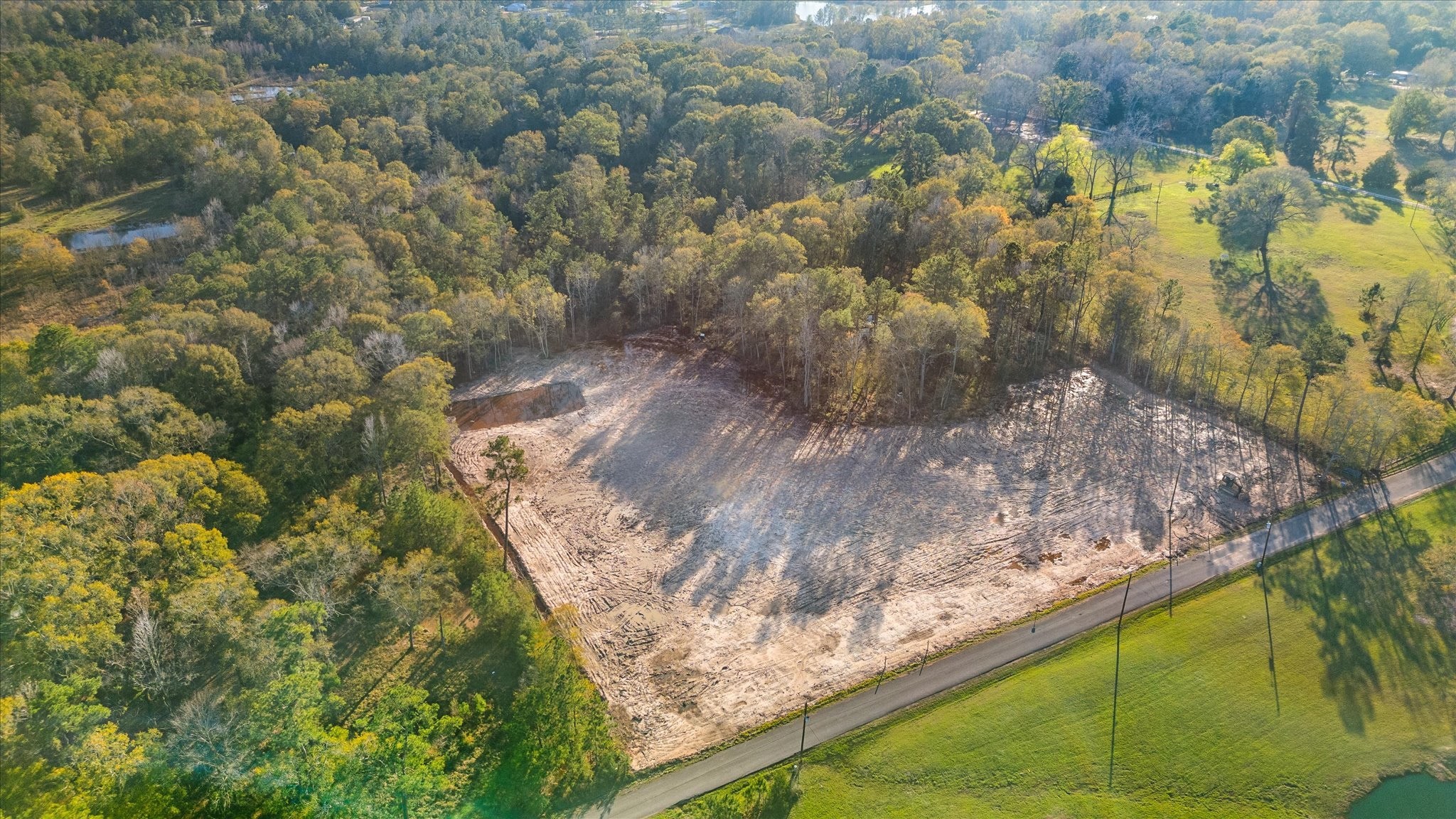 628 County Road 377 Cleveland, TX 77327 - Photo 3 of 10 a view of a garden with an outdoor space