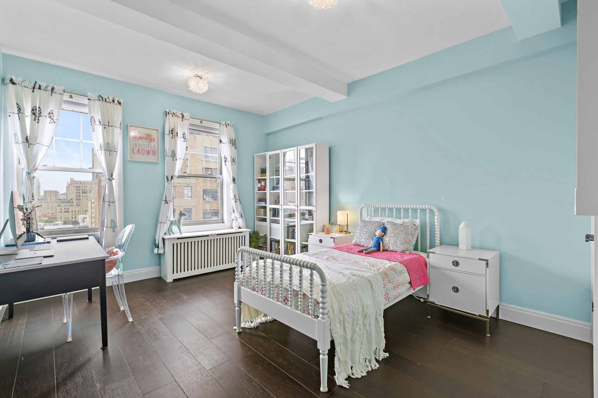 10 West 86th Street, Unit PH15A Manhattan, NY 10024 - Photo 10 of 34 a bedroom with a bed wooden floor and a large window