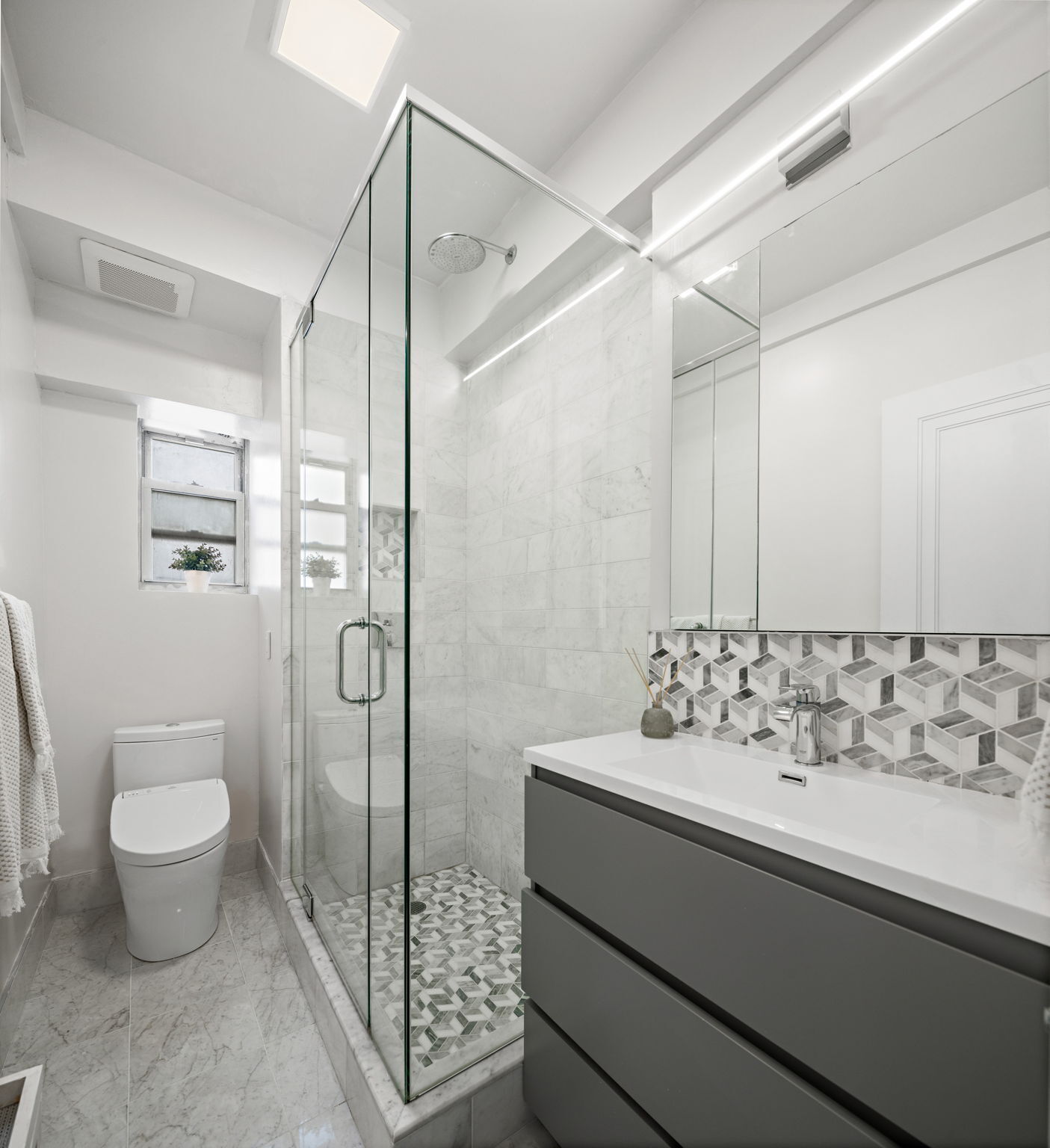 10 West 86th Street, Unit PH15A Manhattan, NY 10024 - Photo 14 of 34 a bathroom with a sink toilet and shower