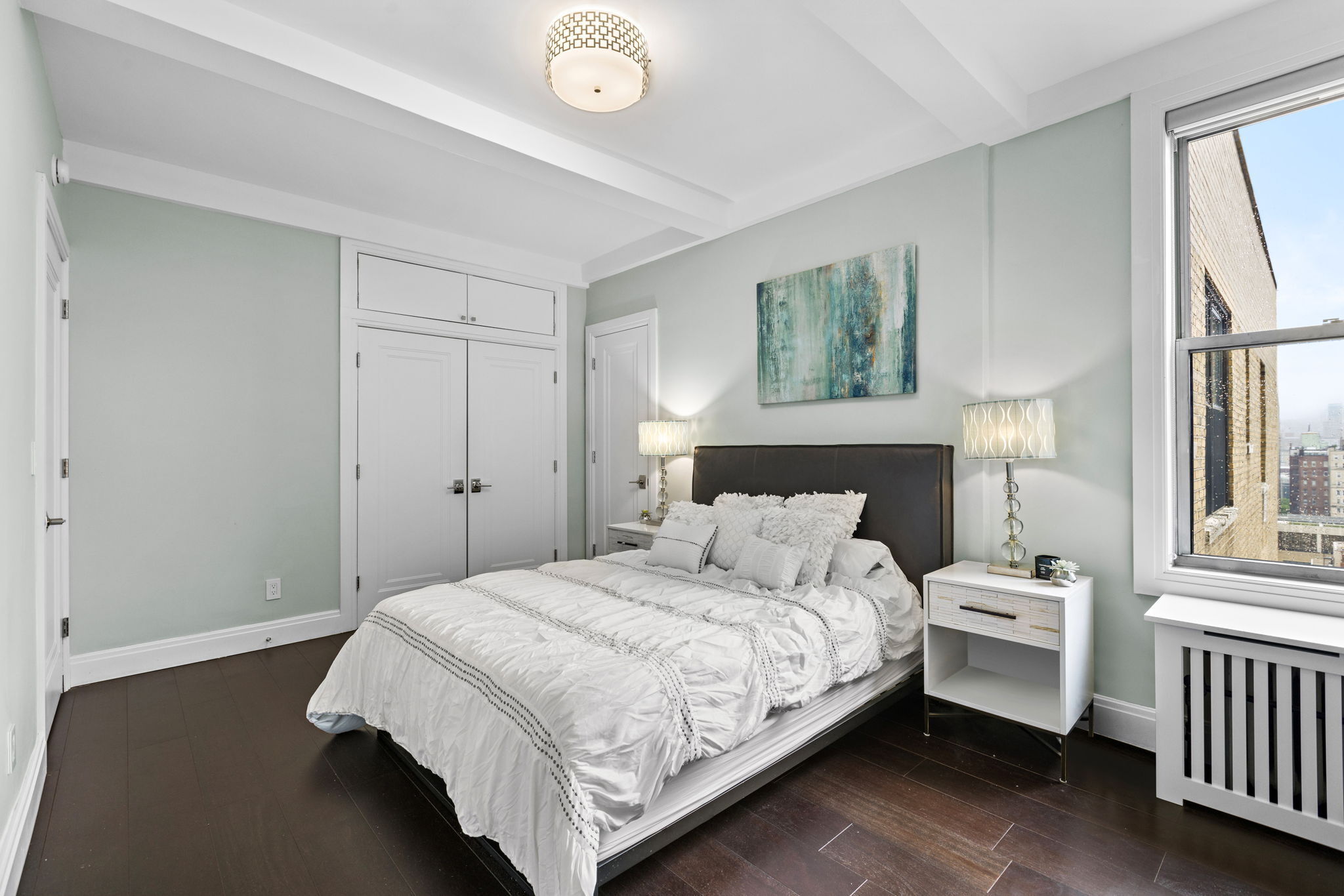 10 West 86th Street, Unit PH15A Manhattan, NY 10024 - Photo 15 of 34 a bedroom with a bed and a window