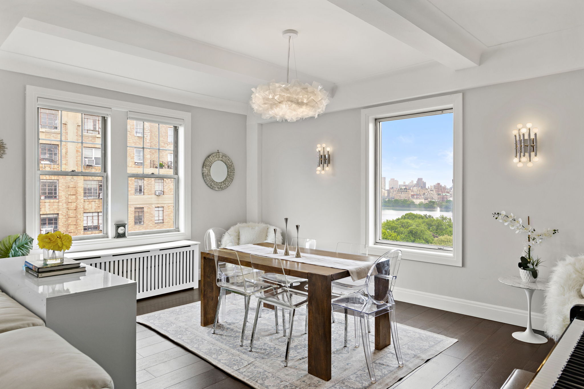 10 West 86th Street, Unit PH15A Manhattan, NY 10024 - Photo 17 of 34 a dining room with furniture a chandelier and wooden floor