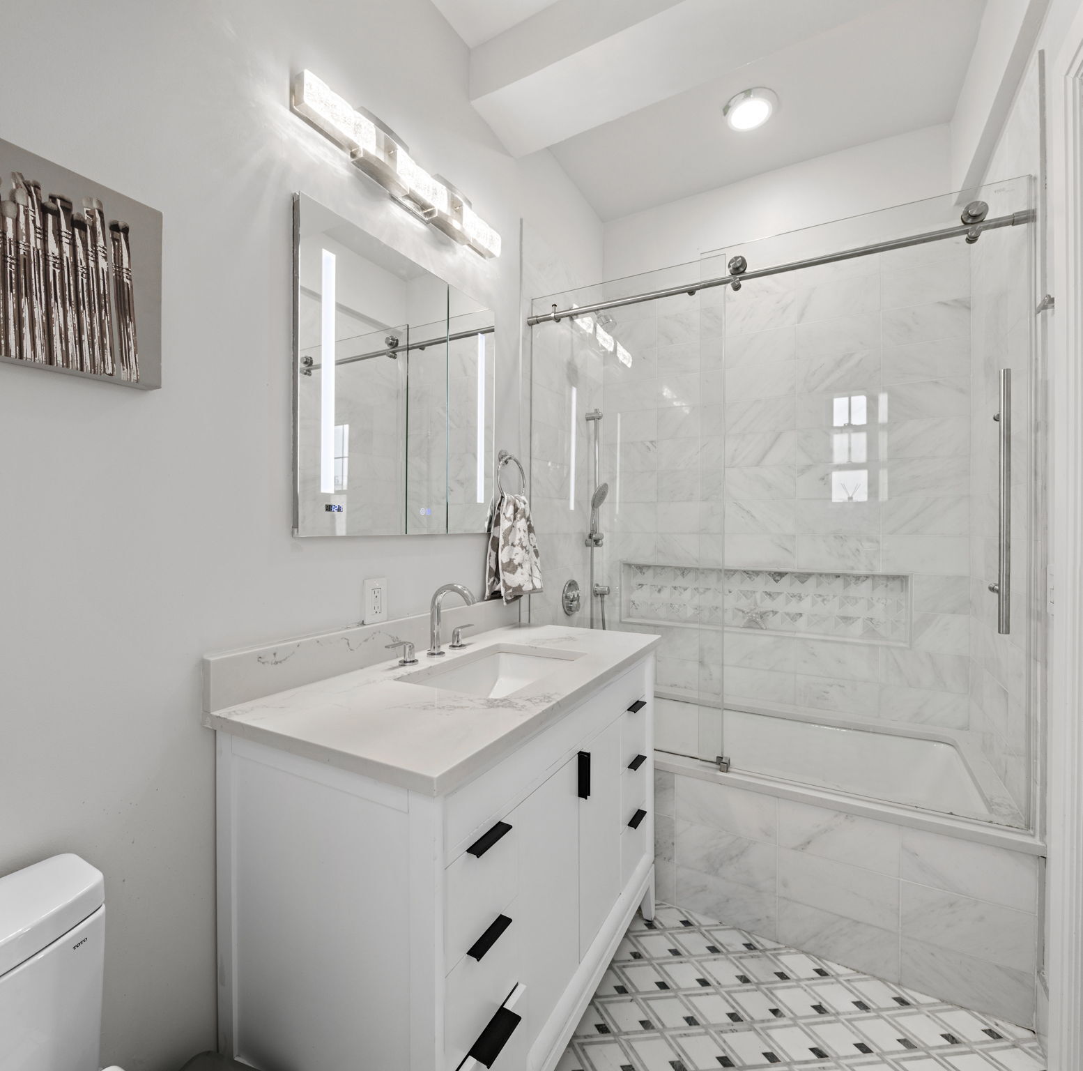 10 West 86th Street, Unit PH15A Manhattan, NY 10024 - Photo 8 of 34 a bathroom with a sink a toilet and shower