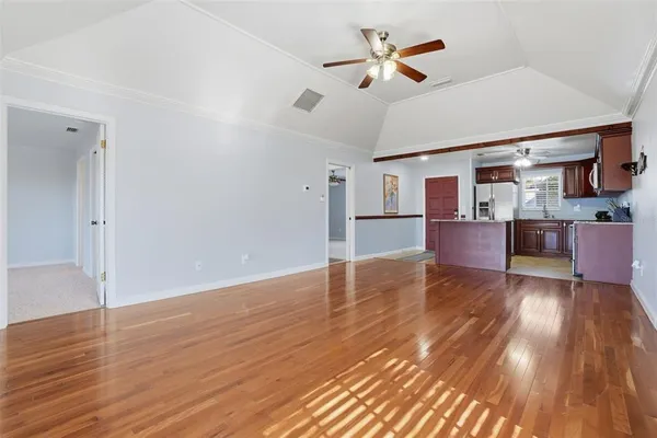 a view of kitchen with cabinets and wooden floor