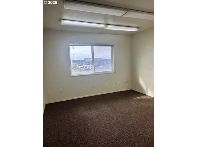 a view of a hallway with a window