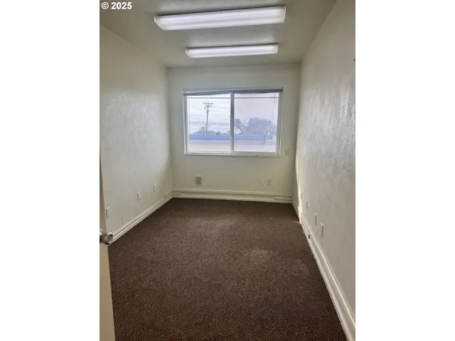 a kitchen with stainless steel appliances a refrigerator and a stove top oven